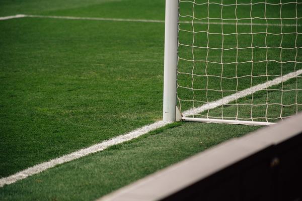 Close up photo of a goal post on a football pitch